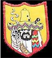 Dieses gelbe Kennzeichen mit roter Umrandung in Form eines Wappens, zeigt einen nach vorne blickenden schwarzbärtigen Mann mit gelbem Sombrero, in dem sich zwei Einschusslöcher befinden. Er hält eine qualmende Pistole auf Augenhöhe in Richtung des Betrachters.