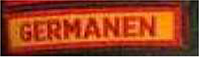 Dieses gelbe Kennzeichen mit roter Umrandung in Form eines Rechtecks, enthält in roten Großbuchstaben die Bezeichnung „GERMANEN“.